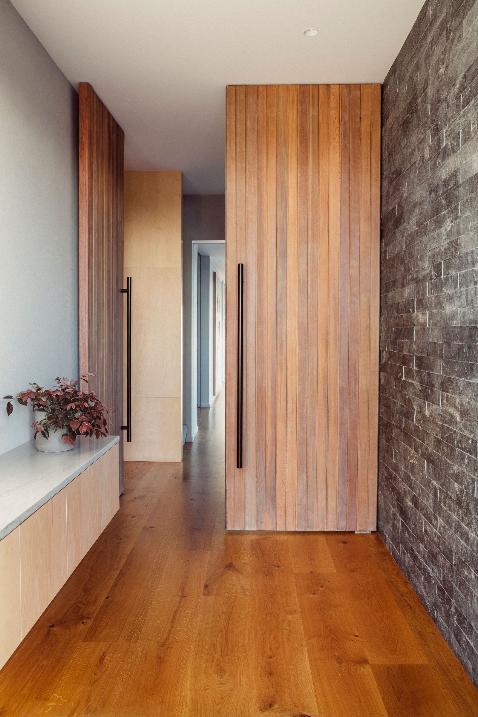Worsley Spur, Cashmere – Port Hills house with bronze anodised upper level by AW Architects – image 7
