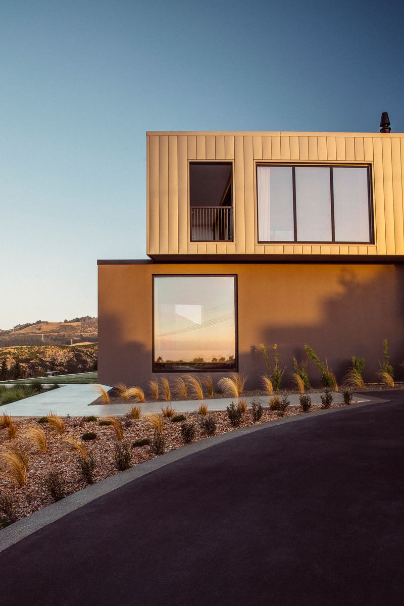 Worsley Spur, Cashmere – Port Hills house with bronze anodised upper level by AW Architects – image 2