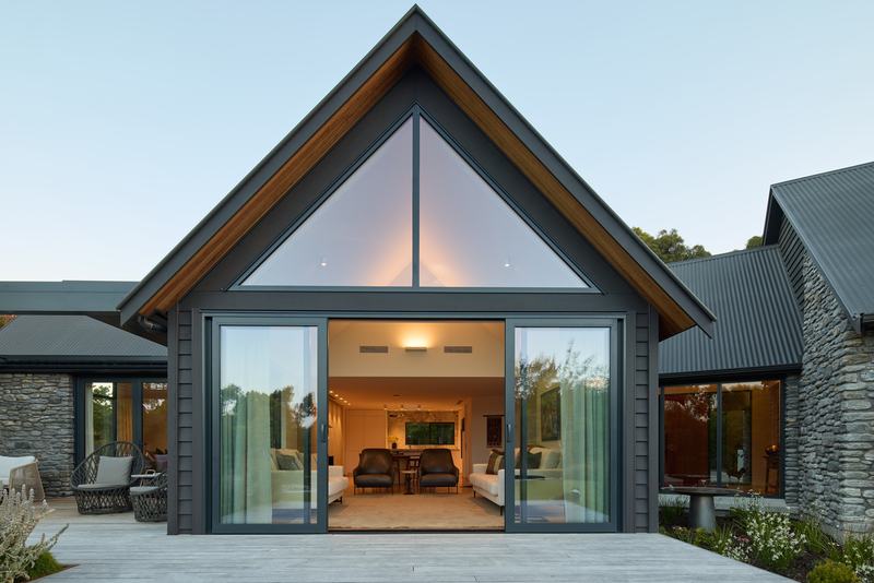 Tai Tapu lakeside home alteration with oak, cedar and clay plaster interiors by AW Architects